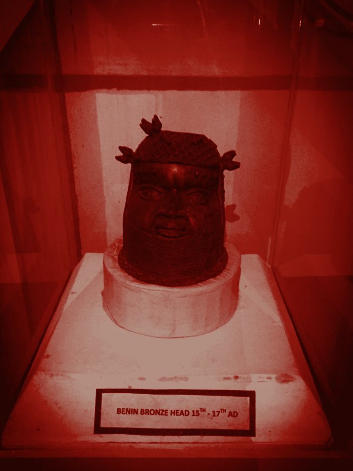 Benin bronze head in a museum display