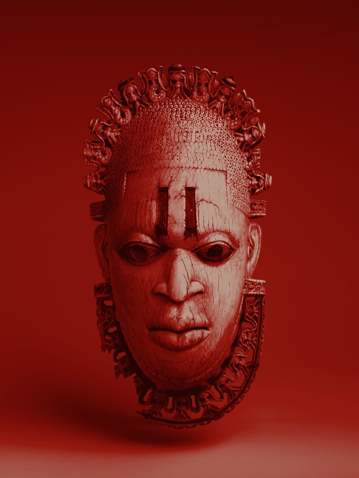 Ivory pendant mask of Queen Mother Idia of Benin, red-toned